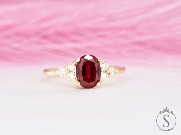 Oval cut red ruby diamond cluster ring front view