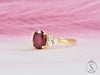 Oval cut red ruby diamond cluster ring front side view