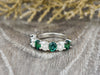 Ivy 2.5 Ct Oval Cut Moissanite and Green Emerald Half Eternity Wedding Band