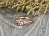 Peach champagne oval cut sapphire with diamond cluster engagement ring side view